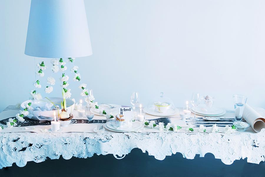 Festive Dining Table For Wedding With Garland Of White Carnations And Candlelight Below Pendant Lamp With White Lampshade Photograph by Matteo Manduzio