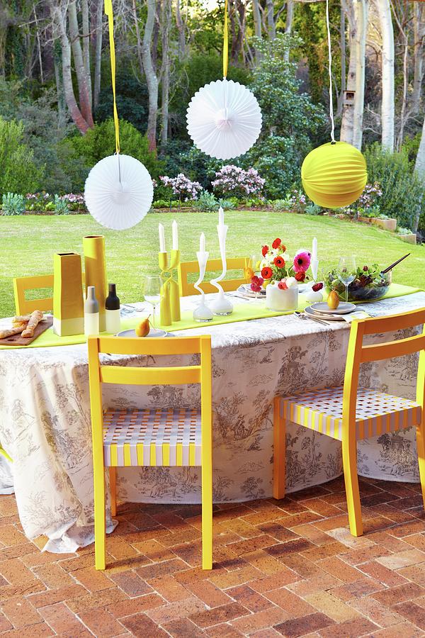 Festive Terrace Table Below Suspended Lanterns Photograph by Great Stock!