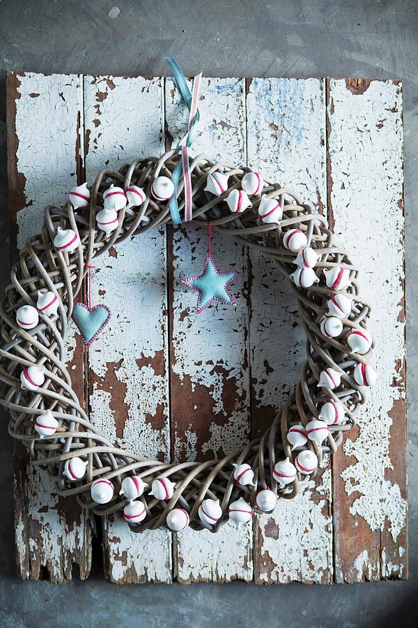 Festive Wreath Decorated With Miniature Meringues On Wall Photograph by Great Stock!