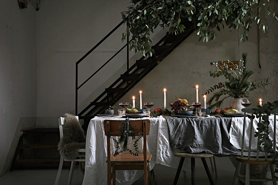 Festively Set, Candlelit Dining Table In Loft-apartment Interior Photograph by Nikky Maier