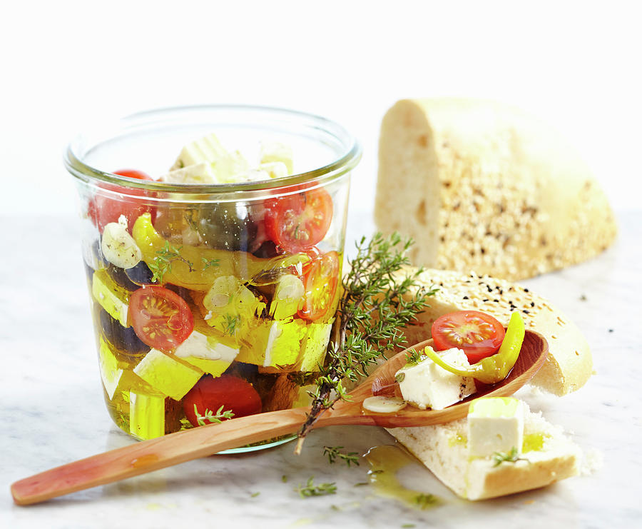 Feta Cheese Preserved In Olive Oil With Tomatoes, Garlic, Jalapenos And Olives Served With Unleavened Sesame Seed Bread Photograph by Teubner Foodfoto
