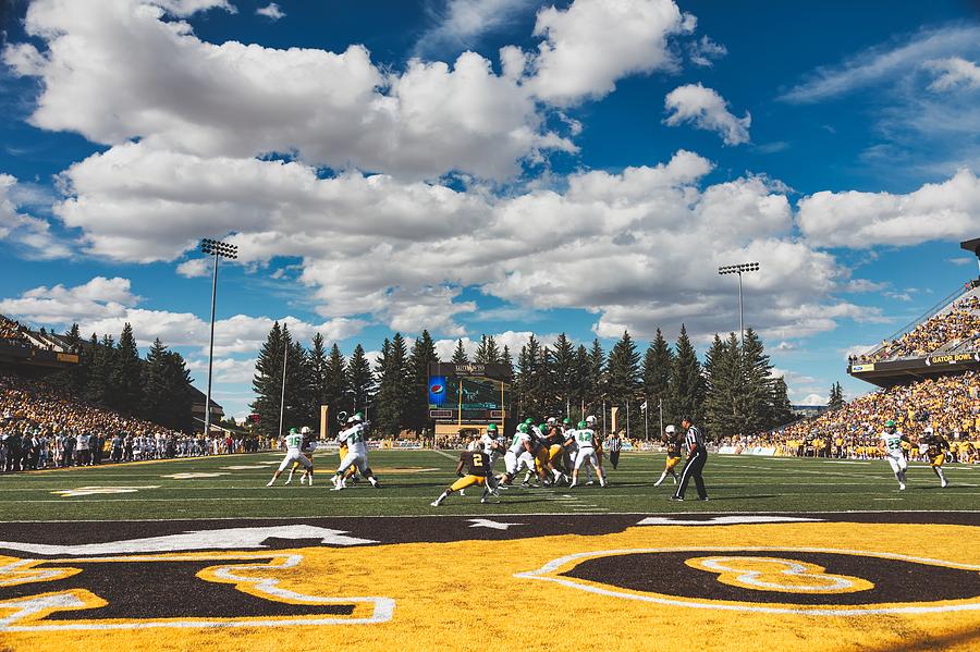 Field Level Action - University Of Wyoming Football Photograph by Mountain  Dreams - Fine Art America