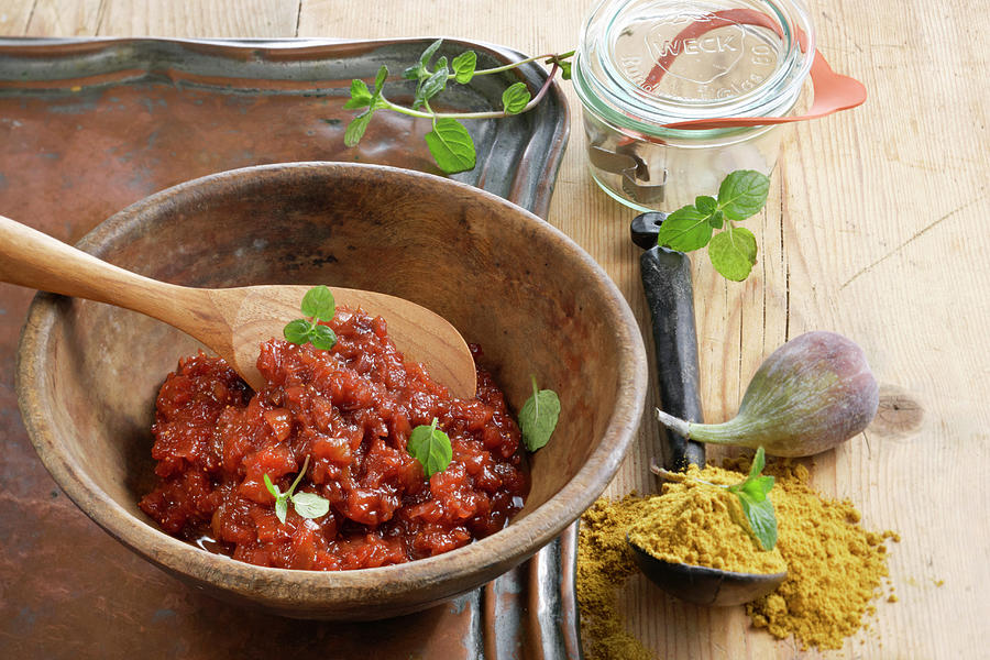 Fig Chutney With Curry Powder In A Wooden Spoon Photograph by Teubner Foodfoto