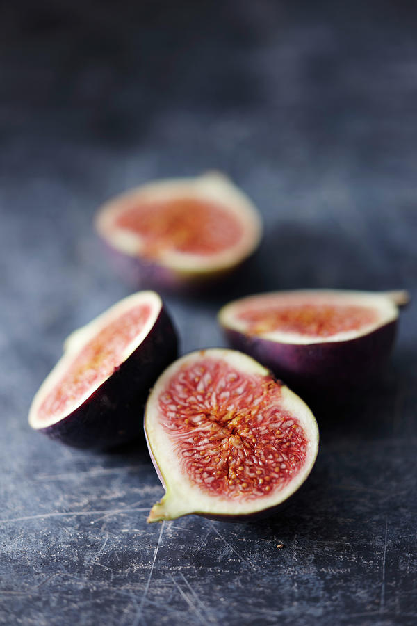 Fig Halves On A Gray Background Photograph by Oliver Brachat