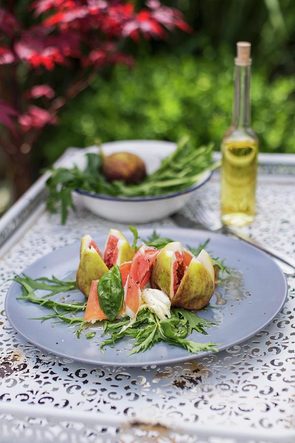 Fig Salad With Mozzarella, Serrano Ham And Basil On Mizuna Photograph by Jan Wischnewski