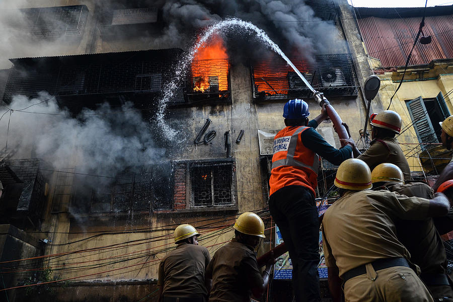 Fight With The Flames Photograph by Debarshi Mukherjee