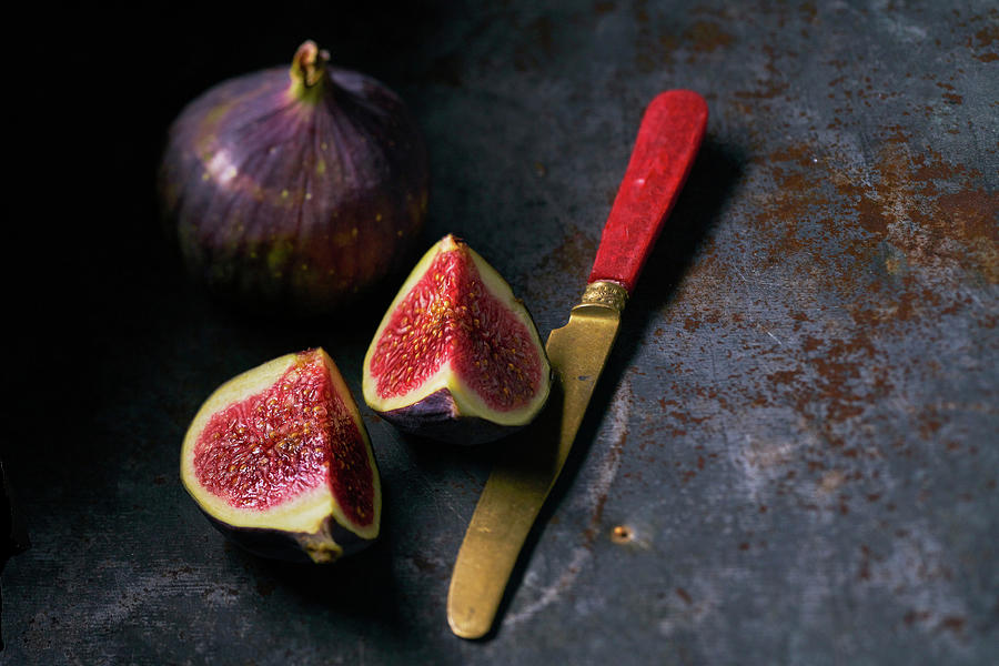 Figs One Halved With Knife Photograph by Arjan Smalen Photography