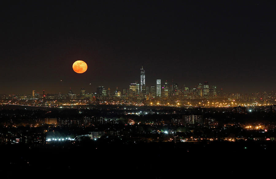 File Photo of the Moon Rising over New Photograph by Gary Hershorn ...