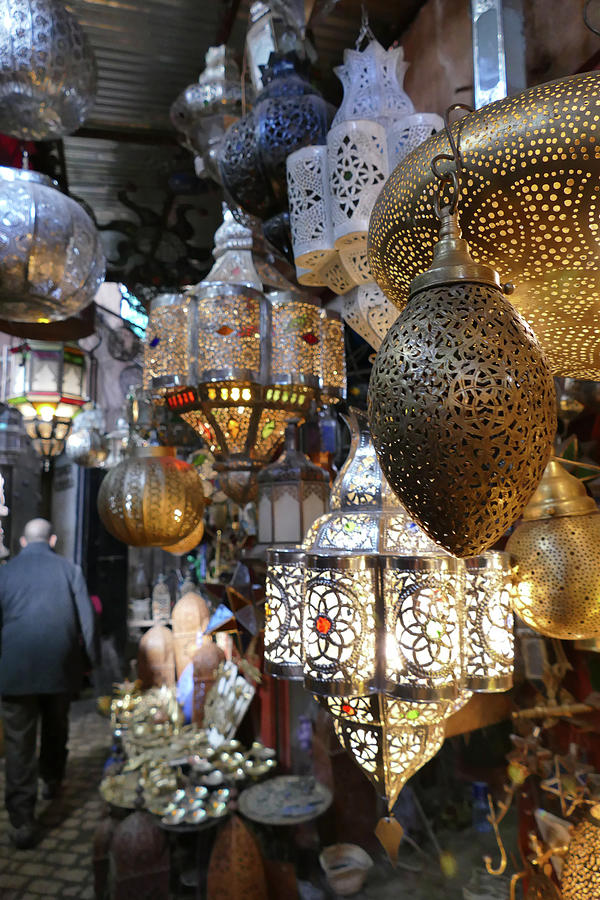 Filigree metal lamps in a shop in the medina  Photograph by Steve Estvanik