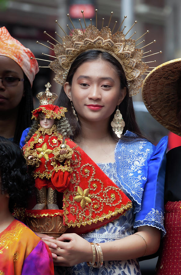 Filipino Day Parade NYC 2019 Young Girl Holding Religious Statue Photograph by Robert Ullmann