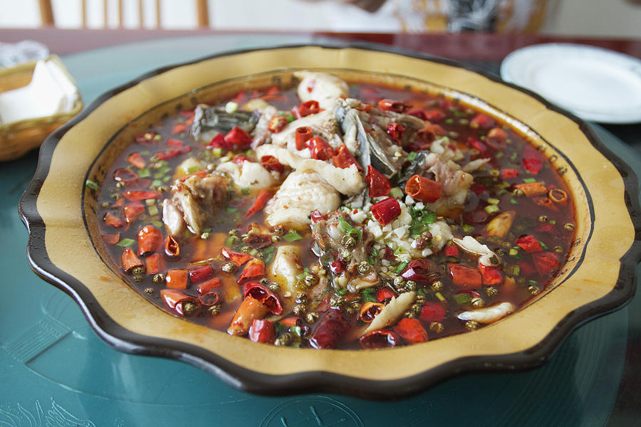 Fillet Of Fish In Hot Chili Oil Photograph by Roy Hsu