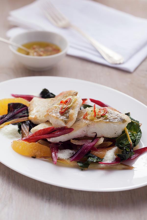Fillet Of Fish With Chard And Orange Segments Photograph by Eising Studio