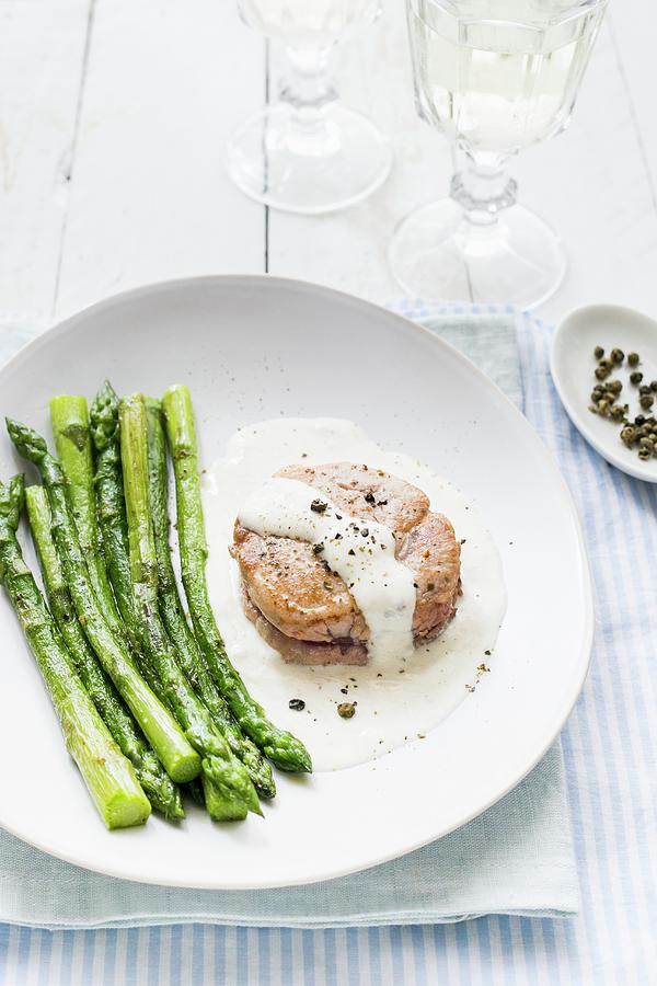 Fillet Of Pork With Creamy Green Pepper Sauce And Asparagus Photograph by Maricruz Avalos Flores