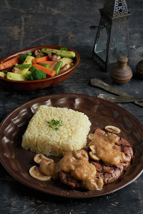 Fillet Steak With Mushroom Sauce And Rice Photograph by Yehia Asem El