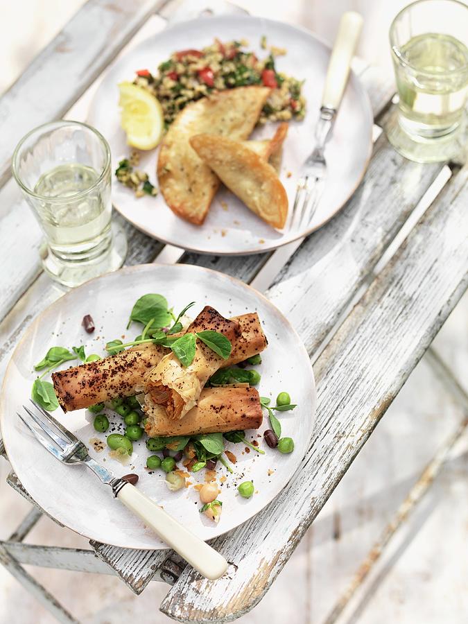 Filo Pastry Rolls On A Pea Salad, Courgette And Halloumi Parcels With Bulgur Salad Photograph by Jonathan Gregson