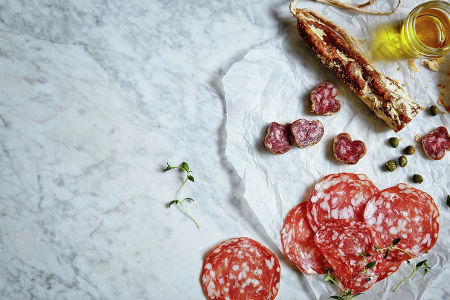 Fine Meats And Delicatessen. Served On A White Marble Photograph by Fanny Rdvik