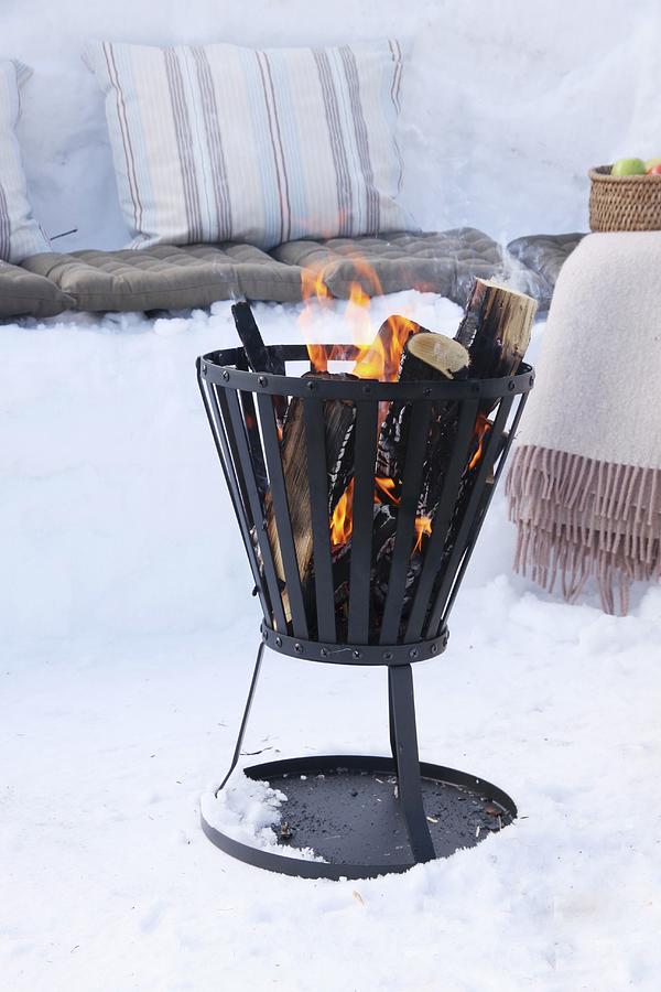 Fire Basket Amongst Snow For Winter Picnic Photograph by Susanna Rosn