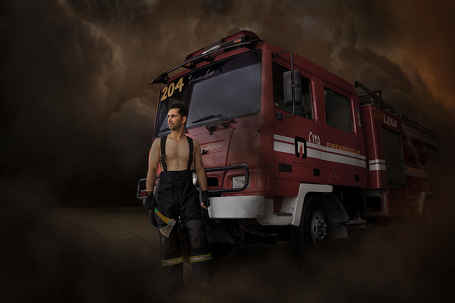 Portrait Photograph - Fire Man by Adelrashidi