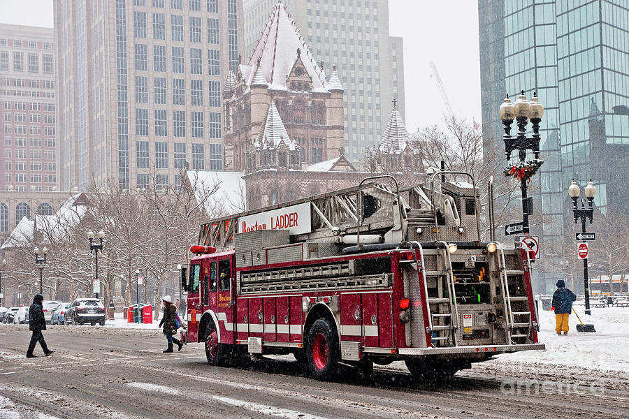 Fire truck traveling the snowy streets of the city. Photograph by Joaquin Corbalan
