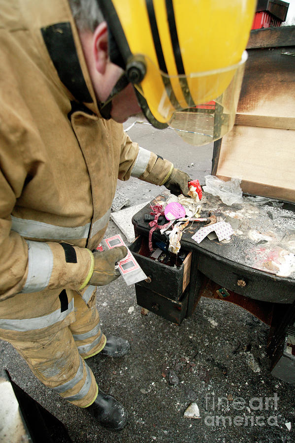 Firefighter Examining Evidence Photograph by Michael Donne/science Photo Library