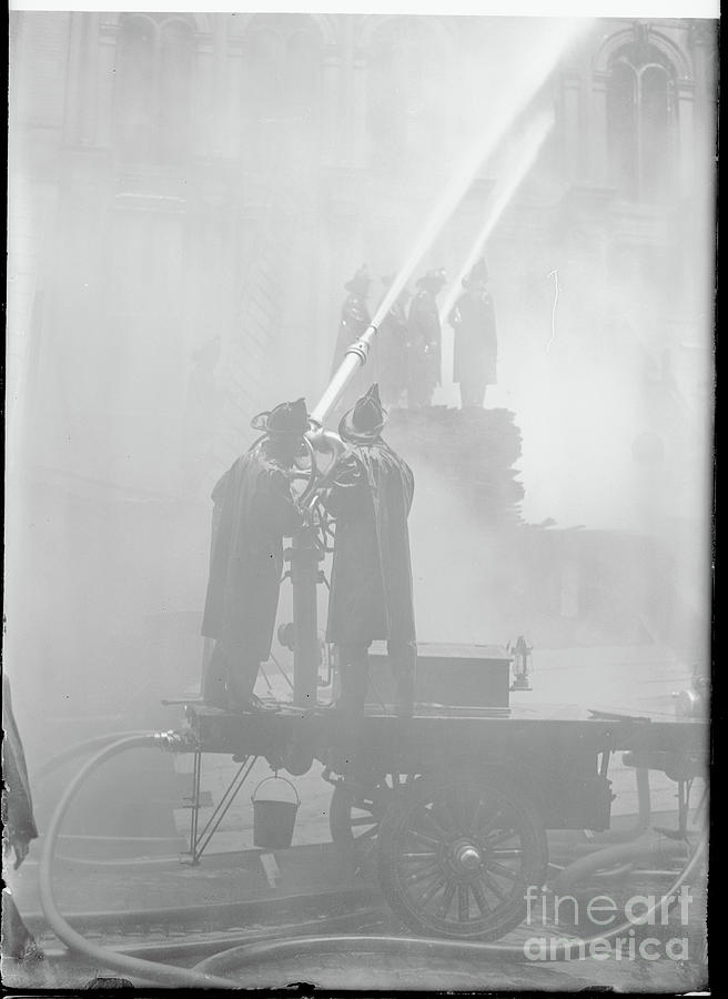 Firemen Attempting To Put Out Fire Photograph by Bettmann