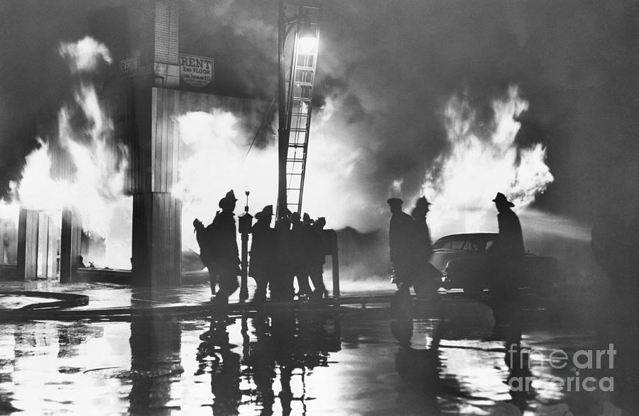 Firemen Silhouetted By Flames Photograph by Bettmann