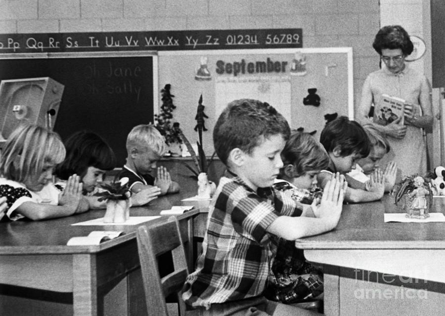 First Graders Pray In Classroom Photograph by Bettmann