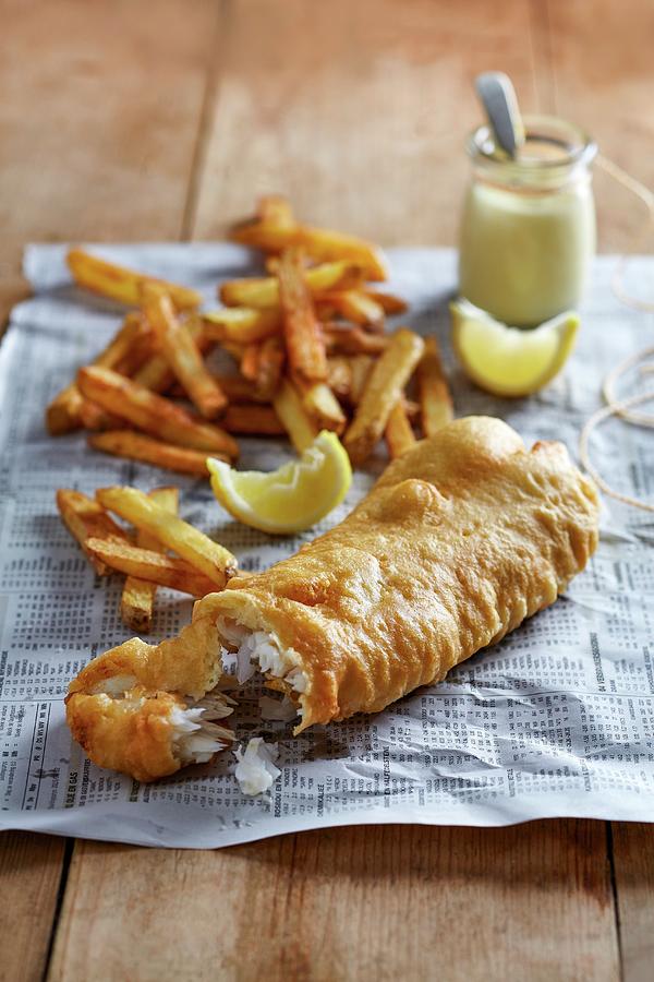 Fish And Chips With Lemon Aioli On A Piece Of Newspaper Photograph by Great Stock!