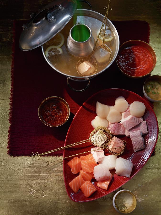 Fish And Seafood Fondue Photograph by Jan-peter Westermann