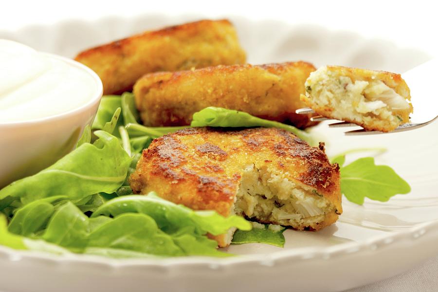 Fish Cakes With Rocket And A Sour Cream Dip Photograph by Creative Photo Services