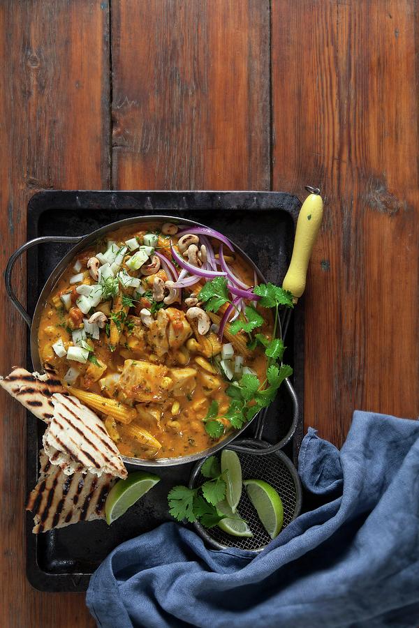Fish Curry With Cashew Nuts, Coconut, Tomato, Fennel Salsa And Grilled Naan Bread Photograph by Great Stock!