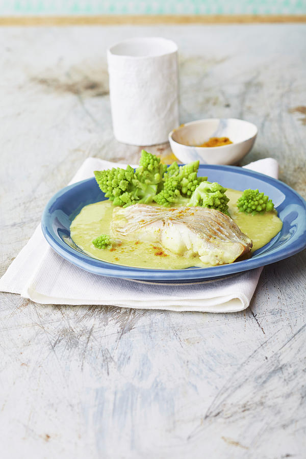 Fish Fillet In A Coconut And Curry Sauce With Romanesco Photograph by Meike Bergmann
