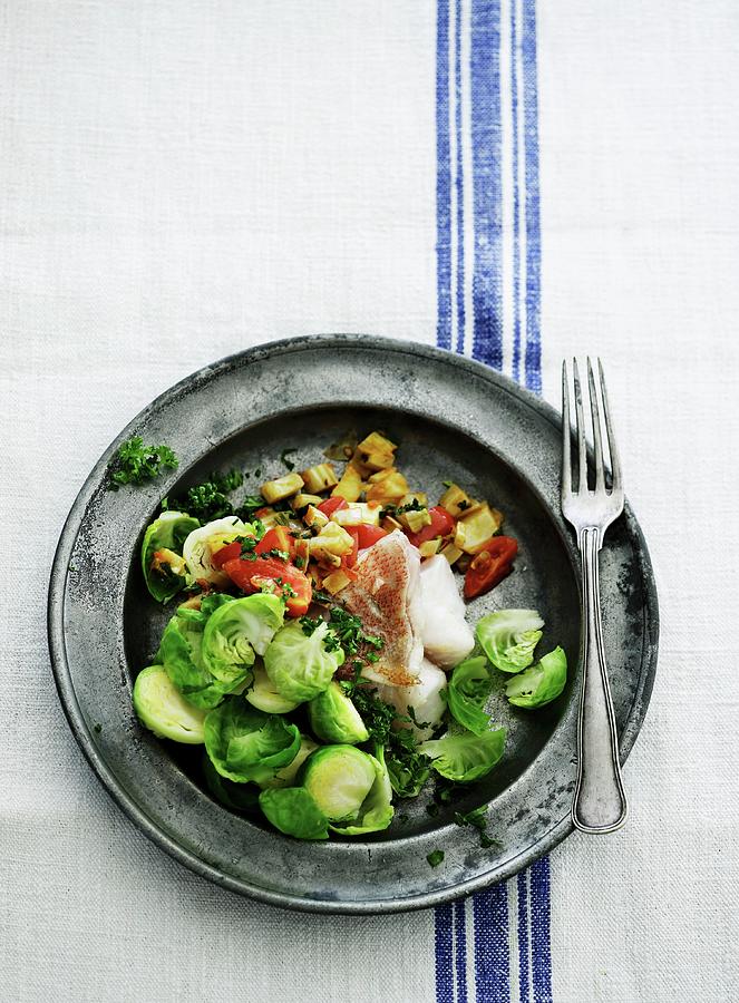 Fish Fillet With A Brussels Sprouts Medley Photograph by Mikkel Adsbl