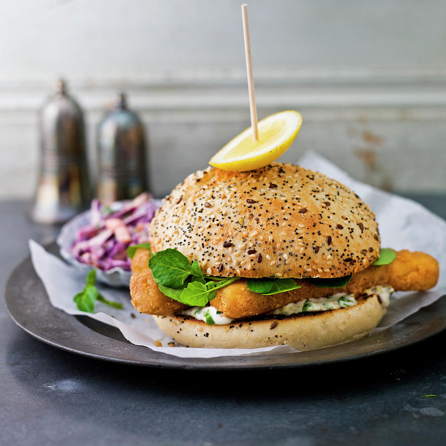 Fish Fingers In A Seeded Roll, With Lettuce, Coleslaw, Lemon Wedge Photograph by Clive Sherlock