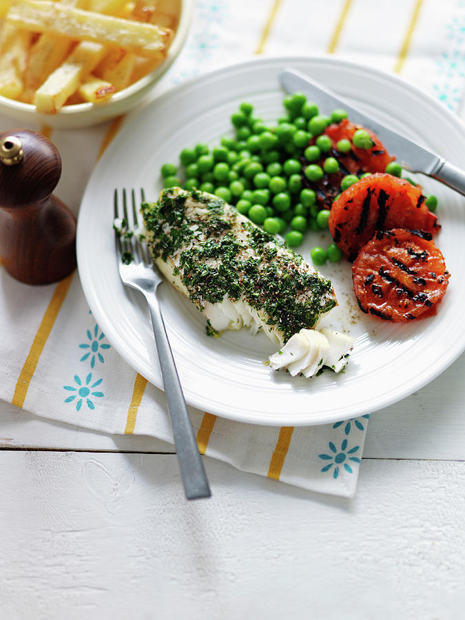 Fish In A Herb Coat With Grilled Tomatoes, Peas And French Fries Photograph by Karen Thomas