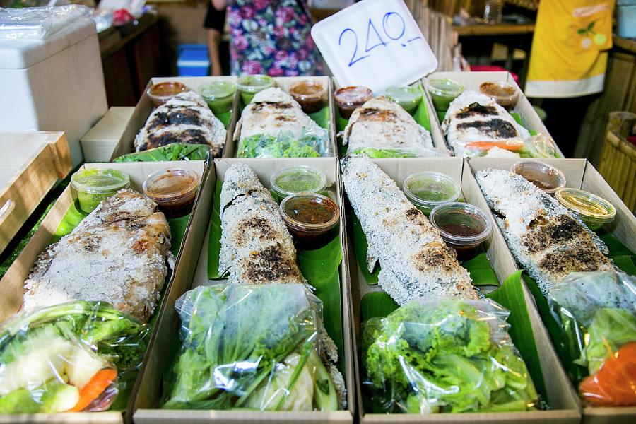 Fish In A Salt Crust With Salad And Sauce At A Market In Thailand Photograph by Maricruz Avalos Flores