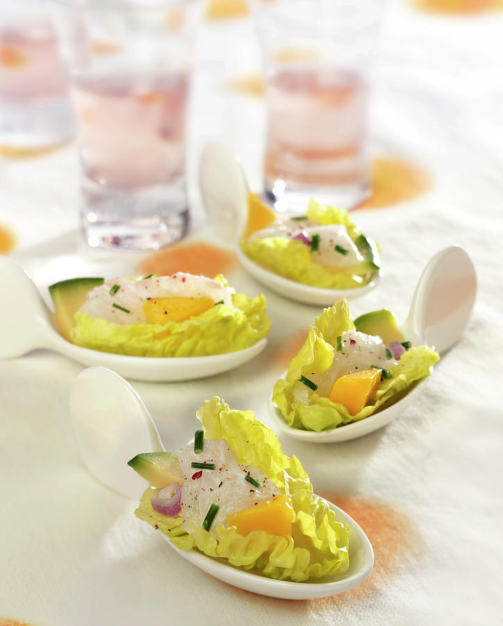 Fish Tartare With Mango And Avocado With Sucrine Leaves Photograph by ...