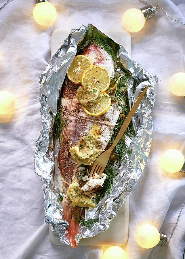 Fish With Fennel And Caper Butter Served In Aluminium Foil Photograph by Great Stock!