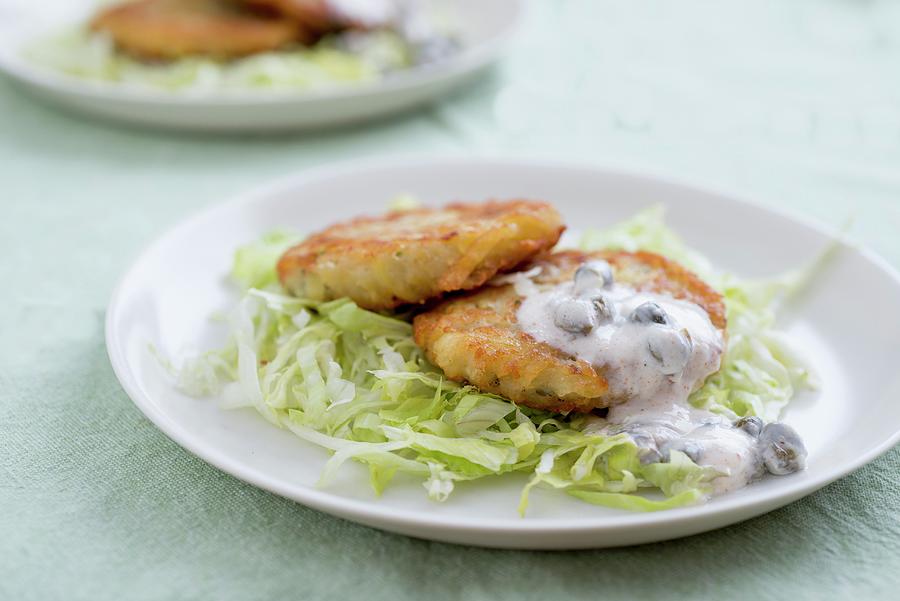 Fishcakes With A Caper Sauce Photograph by Clara Gonzalez