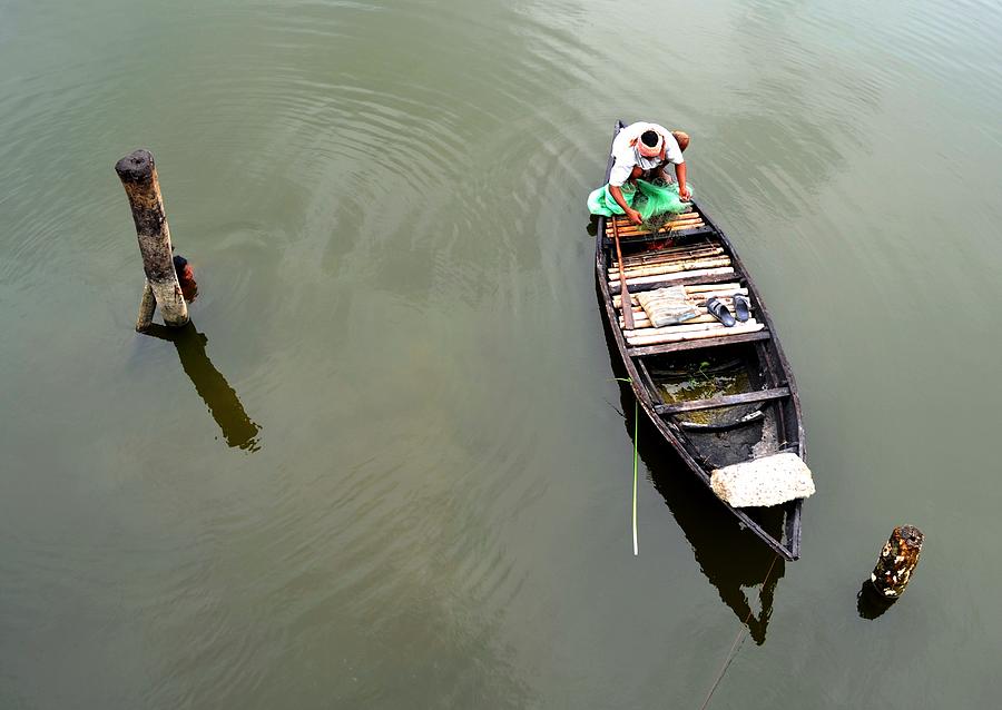 Transportation Photograph - Fisherman And His Boat by Pallab Seth