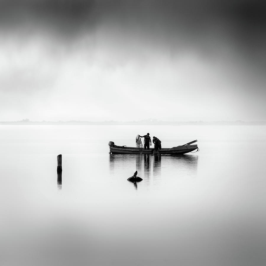 Black And White Photograph - Fisherman And The Curious Bird by George Digalakis