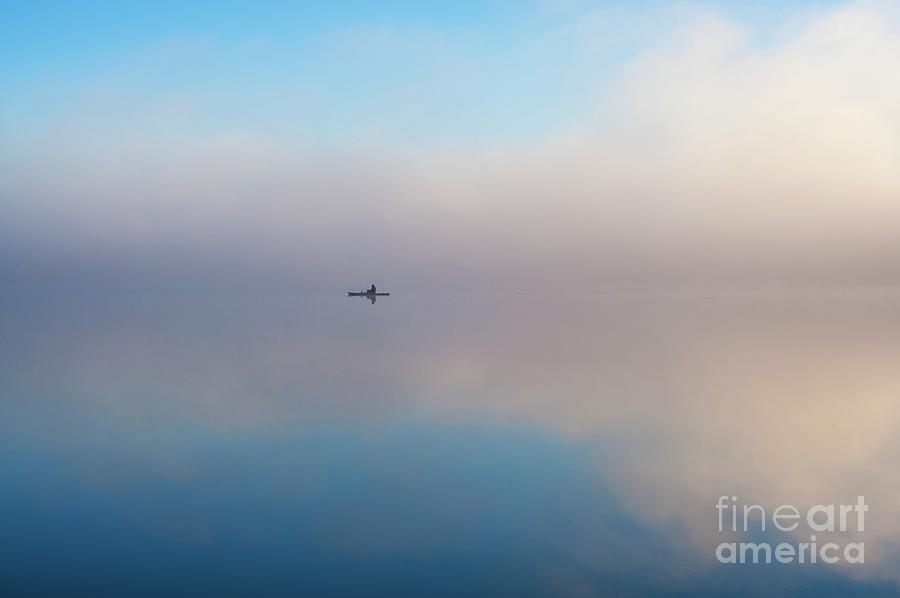 Fisherman in kayak on Lake Cassidy Photograph by Jim Corwin