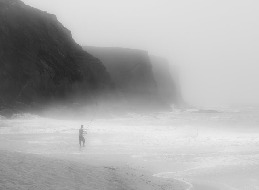 Fisherman In The Mist Photograph by Adolfo Urrutia