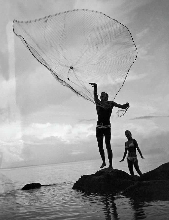 Fisherman Threw His Net Over The Sea Photograph by Keystone-france