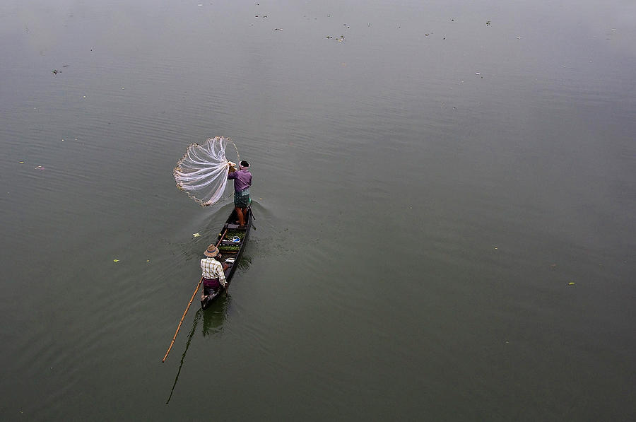 Fisherman Throwing Net Photograph by Vinod Kumar Photography