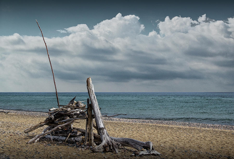 Fishermans Shelter made from Driftwood on the Beach at Whitefish Point Photograph by Randall Nyhof