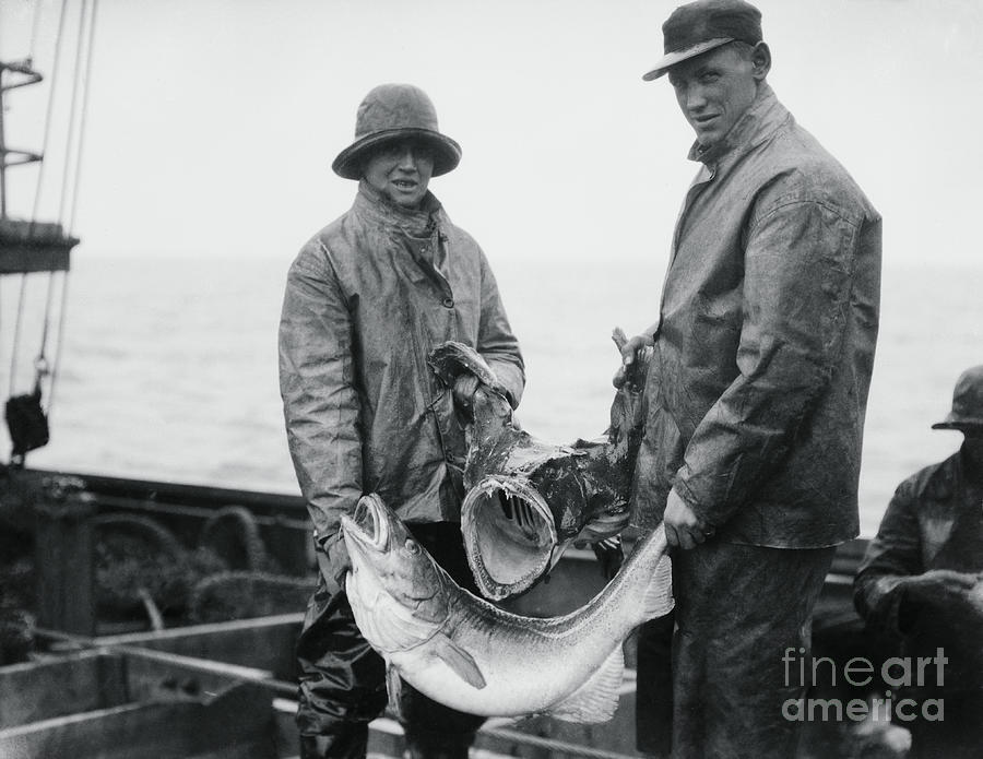 Fishermen Holding Fish Photograph by Bettmann