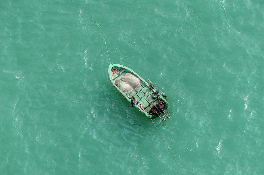Fishing Boat Moored Off Coast, Sanya Photograph by Paul Todd
