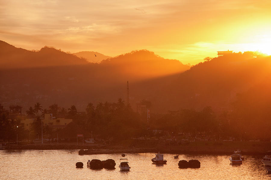 Fishing Boats And Hills At Sunrise Photograph by Holger Leue
