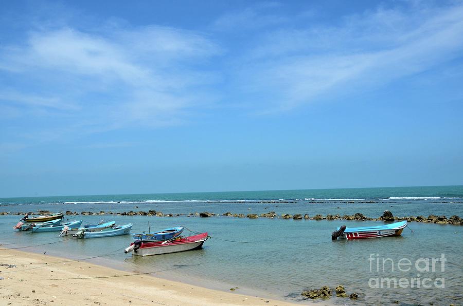 Fishing motor boats parked in shallow water beach Jaffna Peninsula Sri Lanka Photograph by Imran Ahmed